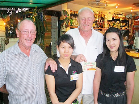 Bill Hewitt and Denis Dixon pose with staff members from The Relax Bar.